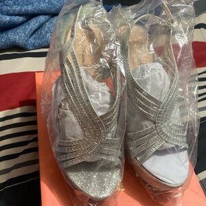 Brand new silver wedges size 8